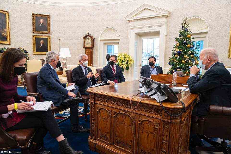 Joe Biden is seen on Sunday in the Oval Office with his chief of staff, Ron Klain (far right), Anthony Fauci (center) and the White House coronavirus coordinator, Jeff Zients (second from left)