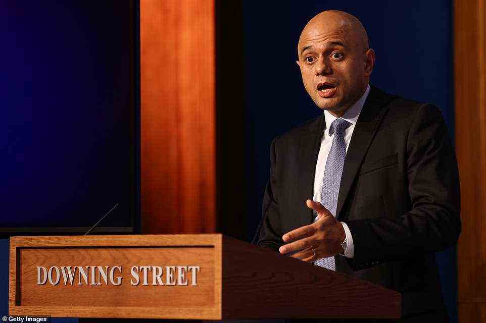 Health Secretary Sajid Javid speaks during a news conference at the Downing Street Briefing Room this afternoon. He said the booster programme would be put 'on steroids' to meet the target, while NHS England's chief executive Amanda Pritchard said staff are working at 'breakneck speed'