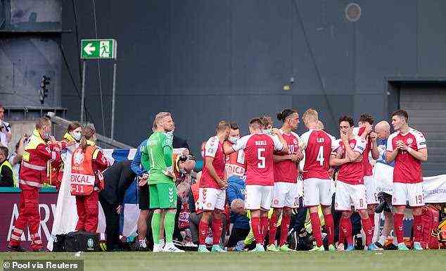 Denmark players circled Eriksen so he had privacy while he was being treated on the pitch