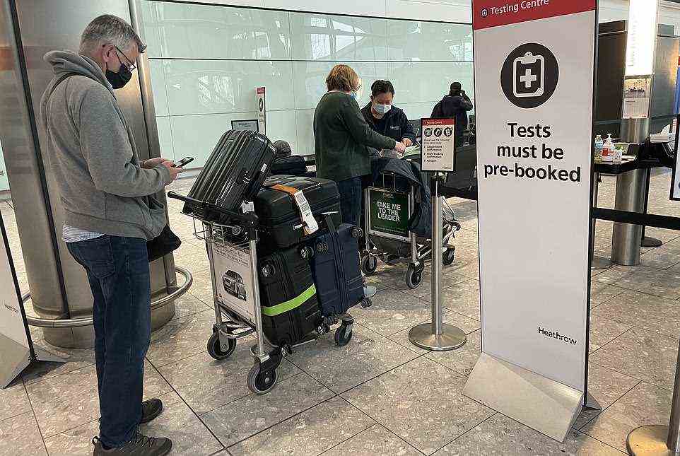 Passengers arrive at London Heathrow Airport last Tuesday as more travel restrictions are brought in by the Government