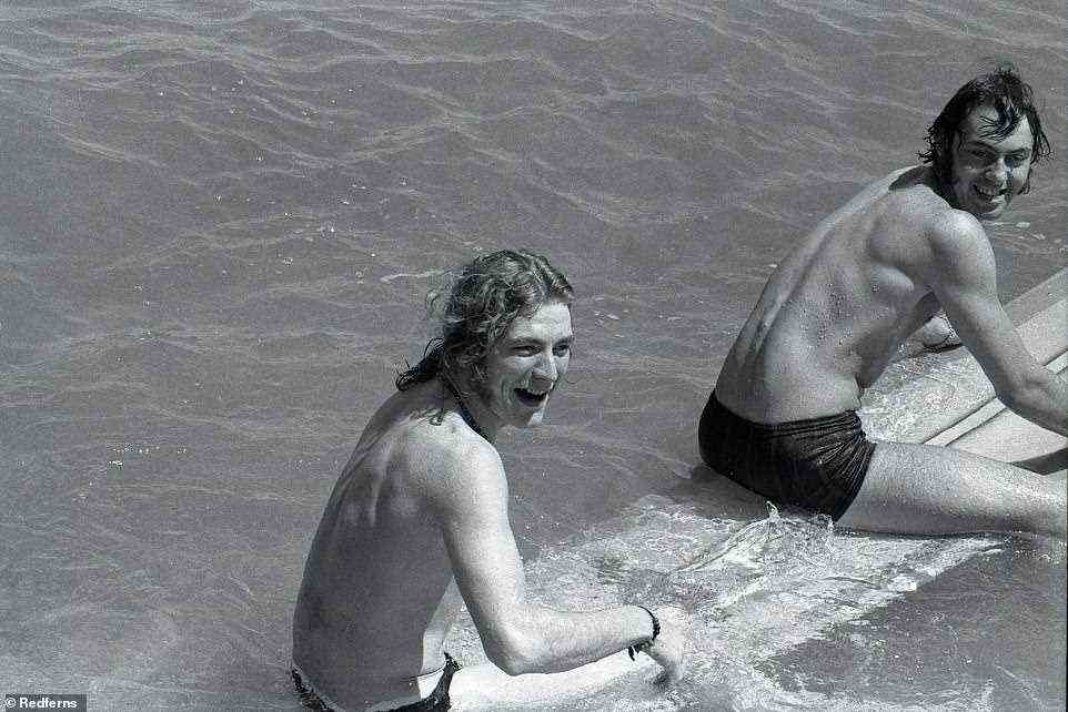 Exploring the world: Robert Plant and Richard Cole on a surf board in Hawaii in May 1969