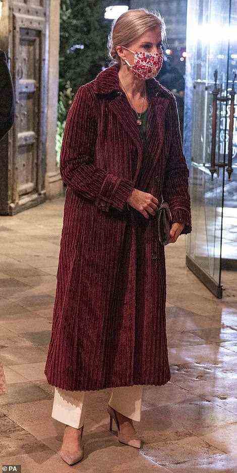 The Countess of Wessex wrapped up in a maroon jacket as she arrived at the event, opting to wear a colourful floral face covering