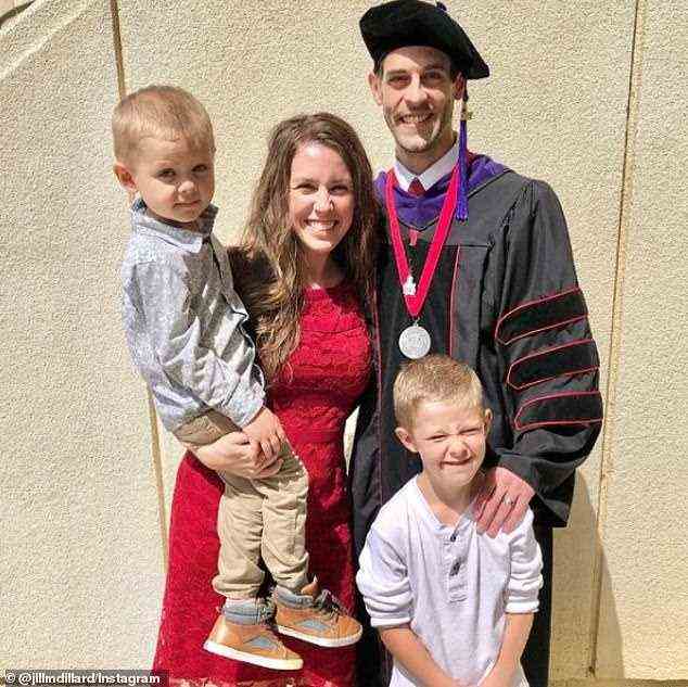 Derick graduated from the University of Arkansas School of Law in May. He and Jill are pictured with their sons