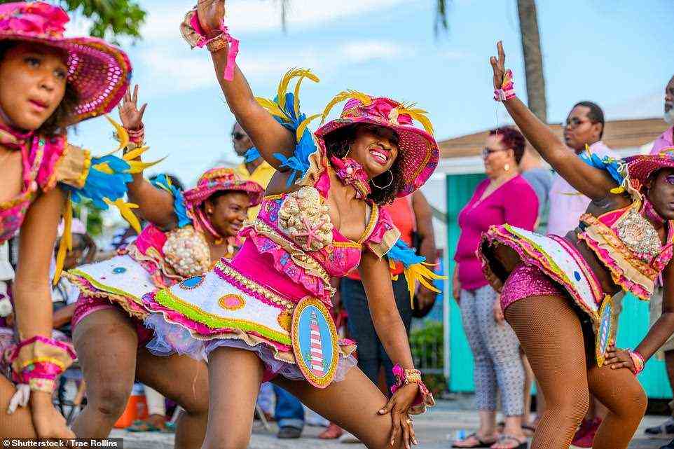 Life and soul: A fun-packed festival parade - known as the 'Junkanoo celebration' - in the Bahamian capital