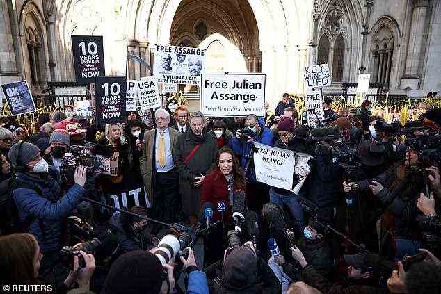 Supporters of Assange join his partner Ms Morris outside the High Court following the ruling