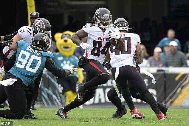 The NFL is way out in front among American sports in terms of media rights' values and viewing figures. Pictured: Atlanta Falcons running back Cordarrelle Patterson (84) rushes for yardage during the first half of an NFL football game against the Jacksonville Jaguars