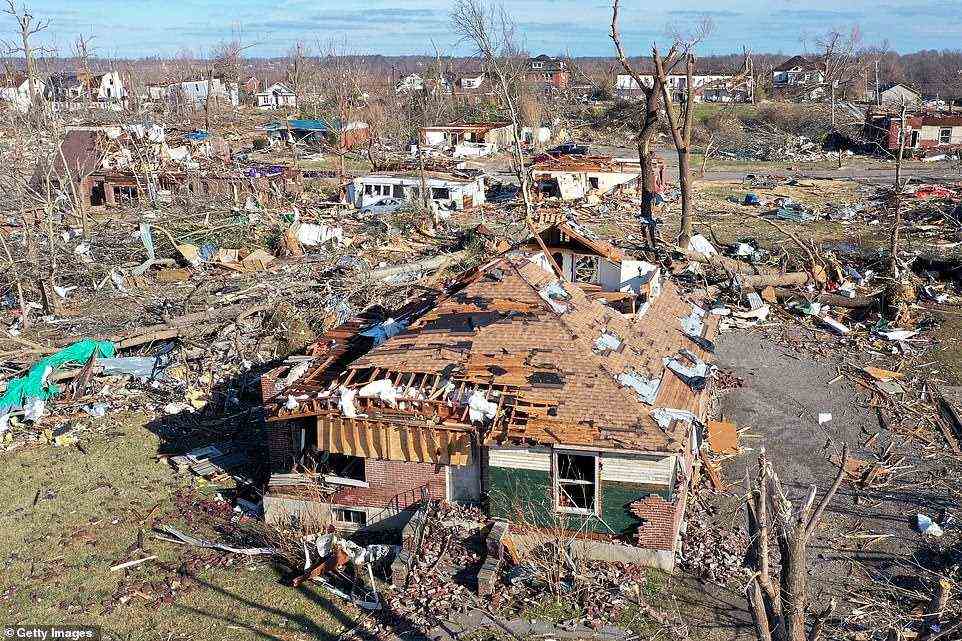 In this aerial view from Mayfield, Kentucky, homes are badly destroyed after a tornado ripped through area the previous evening
