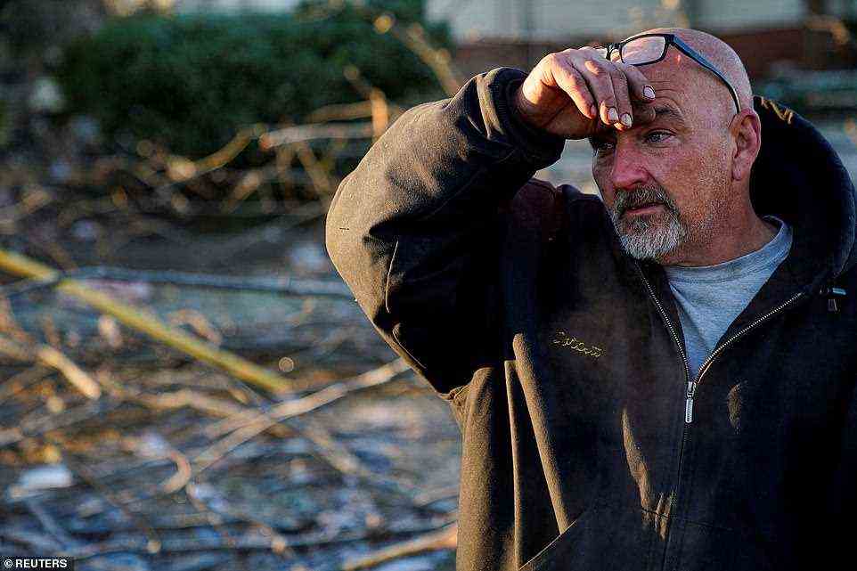 Timothy McDill, 48, tears up on Sunday as he recounts the story of surviving the tornado in Mayfield, Kentucky