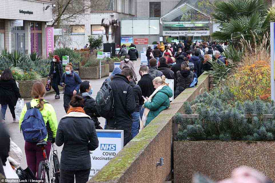 LONDON: Hundreds were pictured queuing outside St Thomas' hospital for Covid boosters today after Boris Johnson told al over-18s to get the top-up jab before the New Year