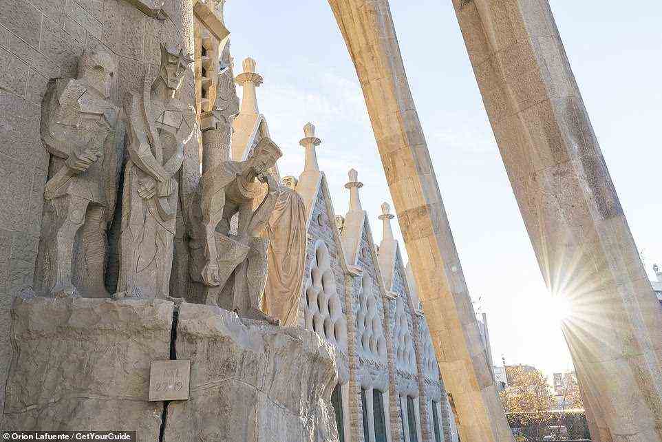Sculptures on the 'Passion Facade'. The church was originally due for completion in 2026, but the coronavirus pandemic has delayed this deadline
