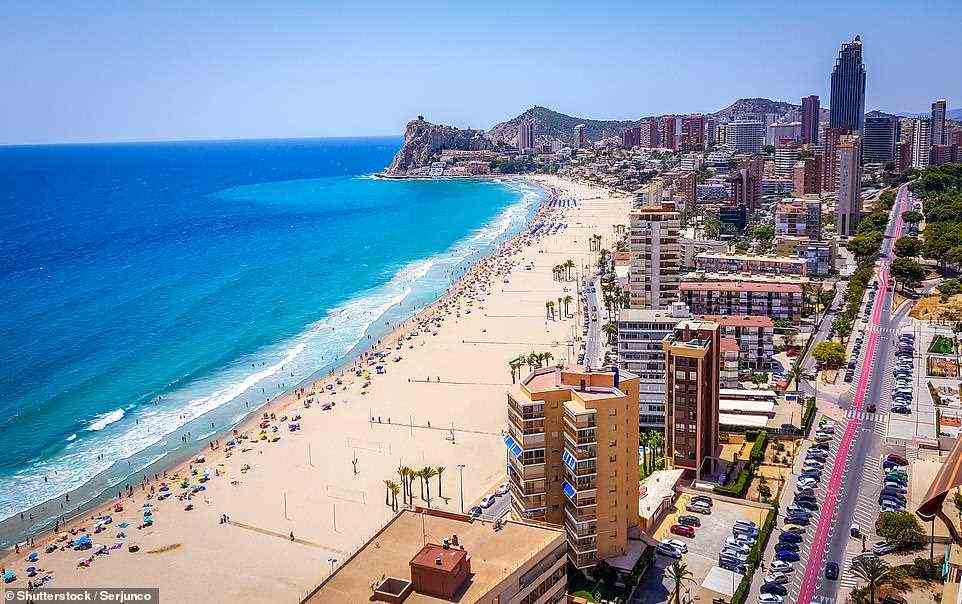 Benidorm: Some holiday firms are offering up to 80 per cent off holidays to Spain (pictured: Poniente beach in Benidorm) this month in a bid to convince uncertain Britons to book a break this winter