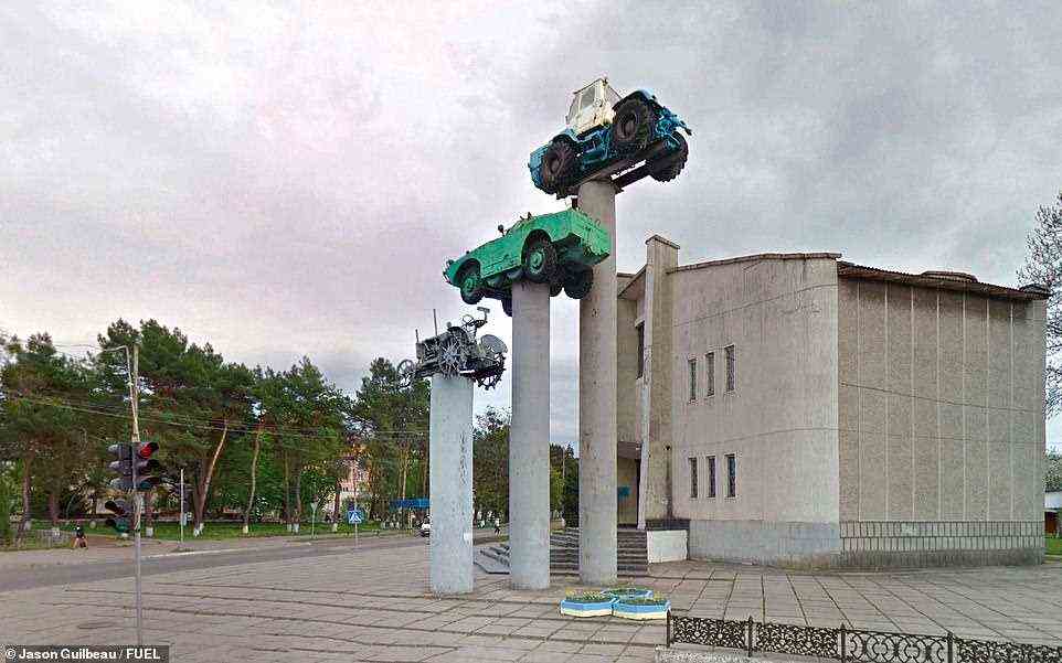'Monuments of tractors, steam trains, trucks, cars and aeroplanes (later to be joined by space rockets), helpfully reminded citizens that, in its efforts to reach new peoples and places, the Soviet authorities had conquered movement in all its forms,' the book reveals. This particular shot shows a monument in the city of Slavuta in western Ukraine