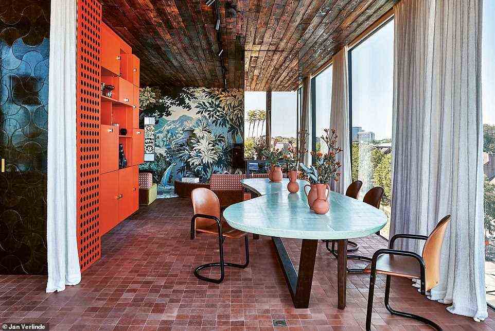 At this penthouse in Ghent, Belgium, you'll see what Demeulemeester describes as a 'festive lasagne of textures, colours and prints'. Interior designer Jean-Philippe Demeyer curated the space for a young globetrotting couple 'who enjoy exciting interiors'. The book reveals that the home is 'a flamboyant ode to chutzpah, playfulness and imagination'