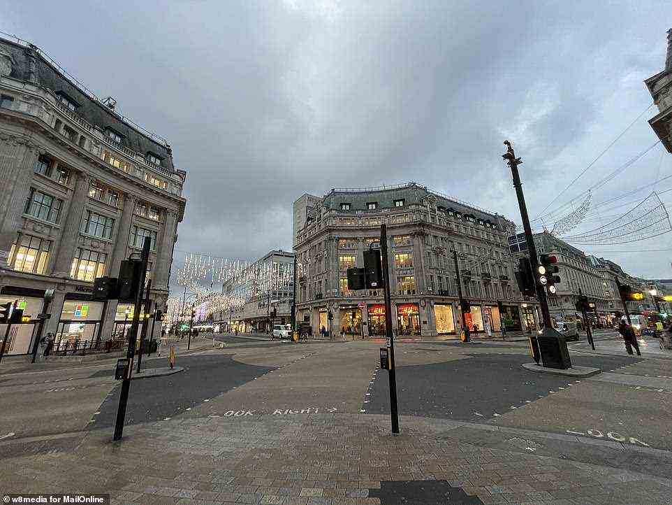A very quiet Oxford Circus in London's West End shopping district at about 9am this morning as people stay at home