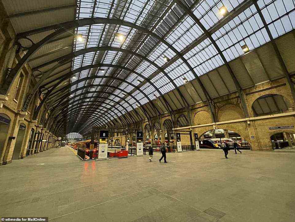 London King's Cross is very quiet at about 8am today as trains wait to depart for the North East of England and Scotland