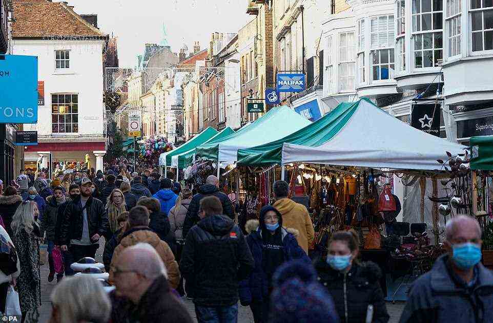 Christmas shoppers make their way along the High Street in Winchester this afternoon at around 2.30pm