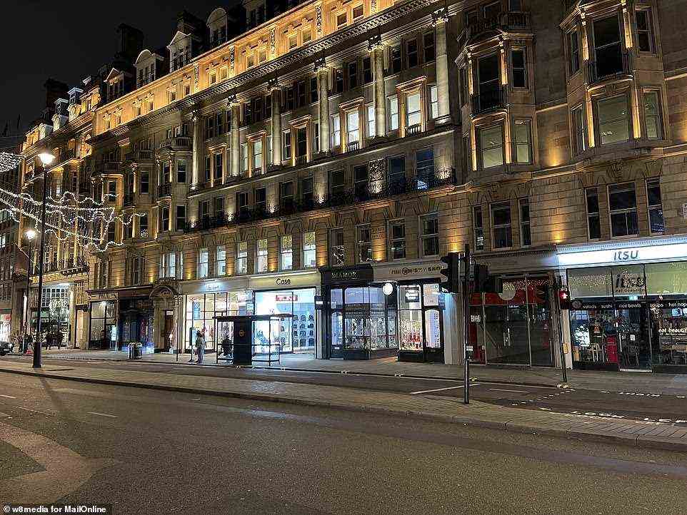 Very few people are seen out and about on Piccadilly in London's West End last night with only four days to go until Christmas