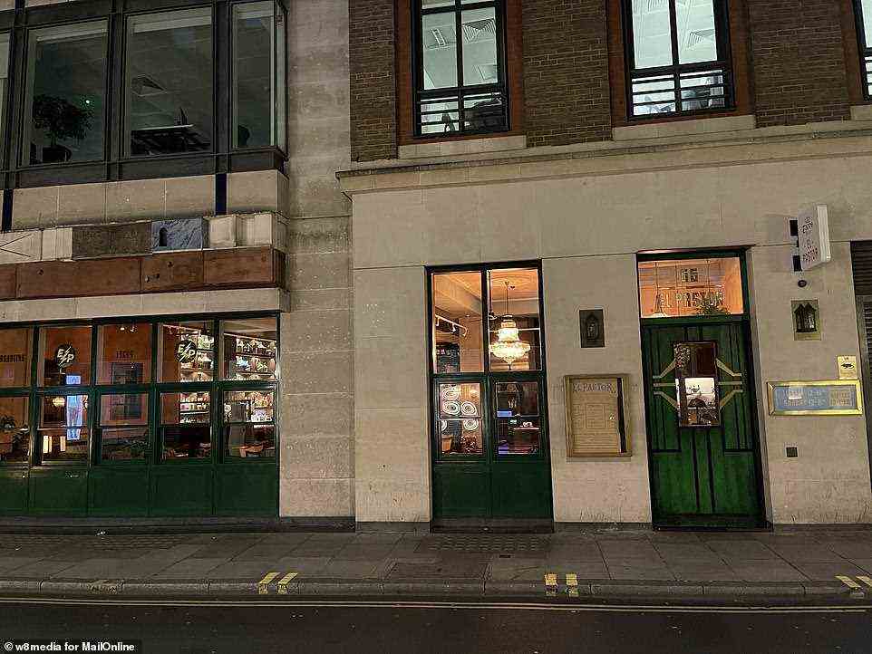 Few people can be seen inside Mexican restaurant El Pastor on Brewer Street in London's West End yesterday evening