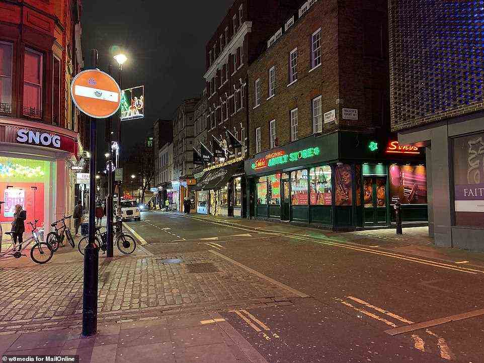 An almost empty Brewer Street in London's Soho last night as the West End district has been left deserted in recent days