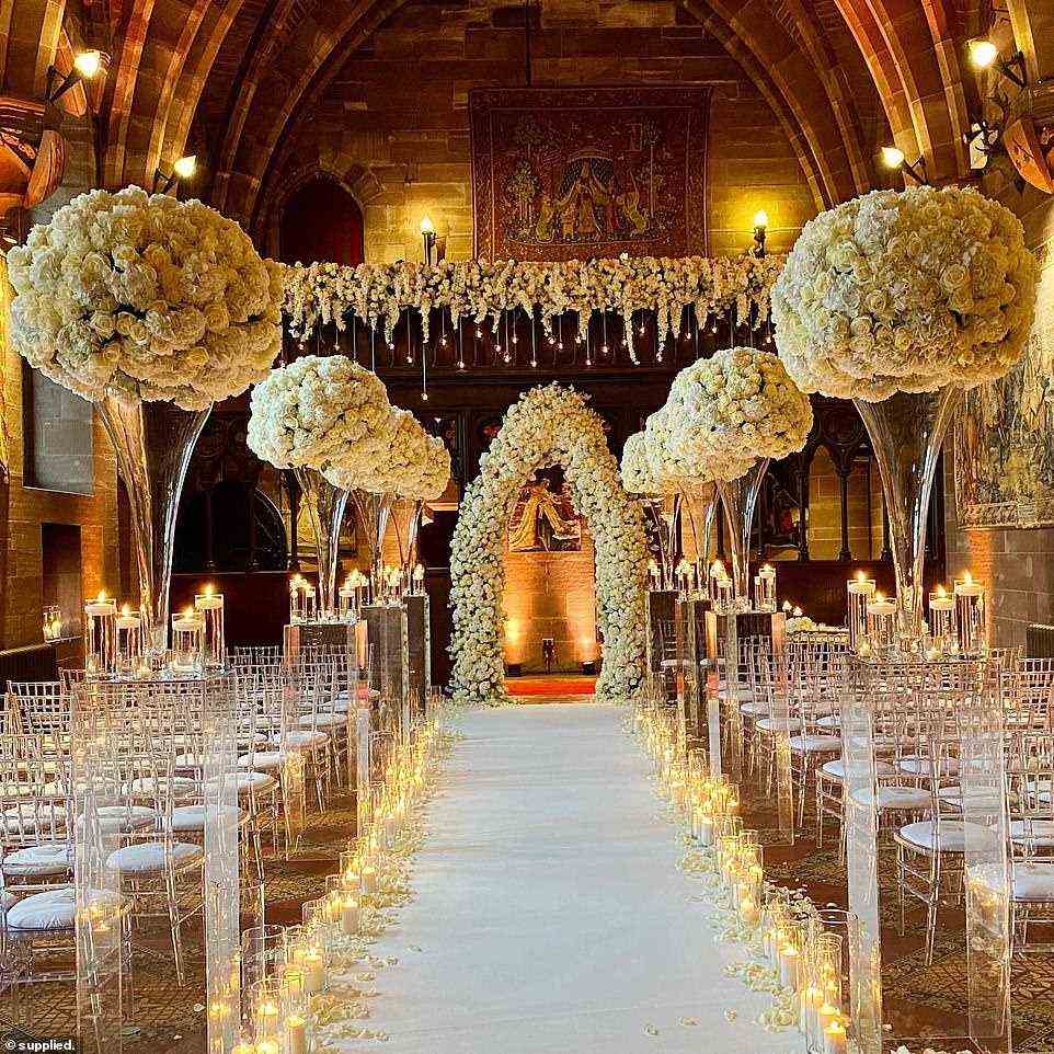 The couple married in a stunning candle-lit room filled with white roses and hydrangeas in front of family and friends
