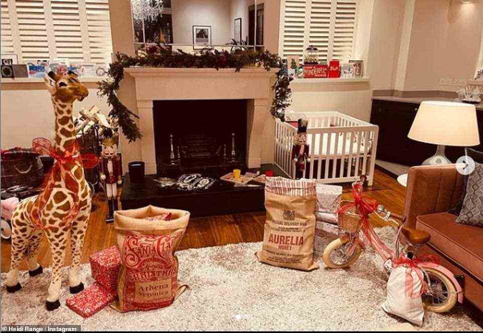 Festive: Singer-songwriter Heidi Range showed off her Christmas living room set-up and wrote: 'He’s Been!!! Merry Christmas'