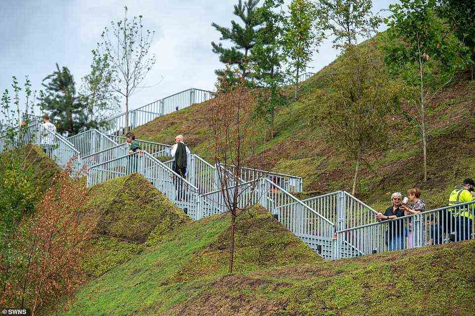 Visitors reach the top of the mound via a long metal walkway. The turf on the mound is only in the early stages of growth