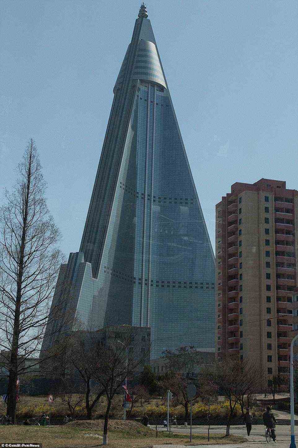 To finally finish the Ryugyong Hotel it would reportedly cost $2billion, which is 5% of North Korea's GDP (around $40 billion)