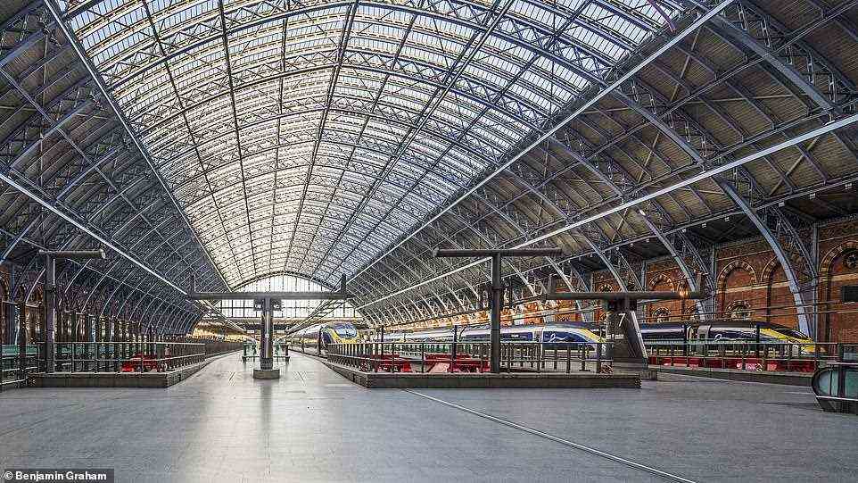 ST PANCRAS -- Eurostar trains prepare for departure under William Henry Barlow's roof at St Pancras - the world's tallest and widest single span structure at the time. It has been in place since the station opened in 1868. The cast-iron trainshed was designed to be 700ft long and reach 100ft above the first floor level of the tracks, tied into the brick piers of the side walls