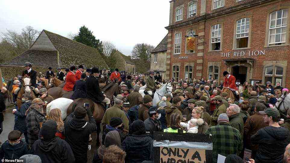 The pro-hunter defended himself as others tried to round on him, with one demonstrator trying to choke him from behind during the vicious attack in Lacock, near Chippenham, in Wiltshire