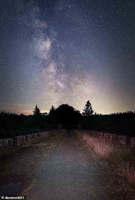 Dan calls this picture 'The Road to the Milky Way'. The composite shot shows the Milky Way over the Kielder Viaduct, a 19th-century bridge in Northumberland. 'In the UK, the galactic centre [of the Milky Way] is in the best position for us to view in the summer, but the light summer nights prohibit our views,' Dan explains, adding: 'The best times to see it are before we lose astronomical darkness in mid May and when astronomical darkness returns in late July.' He adds: 'To get the best view of the night sky it’s important to travel as far as possible from the artificial lighting that plagues urban areas. City lights shroud the fainter stars which dramatically reduces the amount of stars that the human eye is capable of seeing'