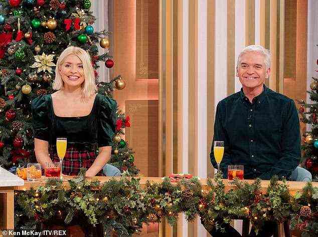 Pals: Holly Willoughby and Phillip Schofield put on a very festive display during Saturday's Christmas special of This Morning