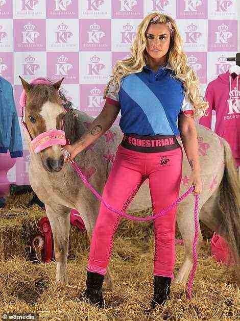 Back at work: Katie Price appeared in good spirits in promotional shots for her equestrian clothing and horsewear launch on Friday, after completing her court-ordered rehab stint at The Priory