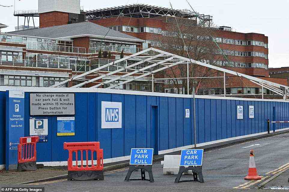 ST GEORGE'S HOSPITAL, SOUTH LONDON: Construction workers began erecting a temporary field hospital in the grounds of St George's Hospital in Tooting today