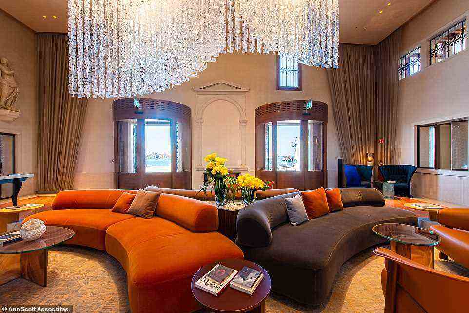 James describes the Murano glass chandelier at the hotel (pictured) as 'a snowdrift of frosted shards'