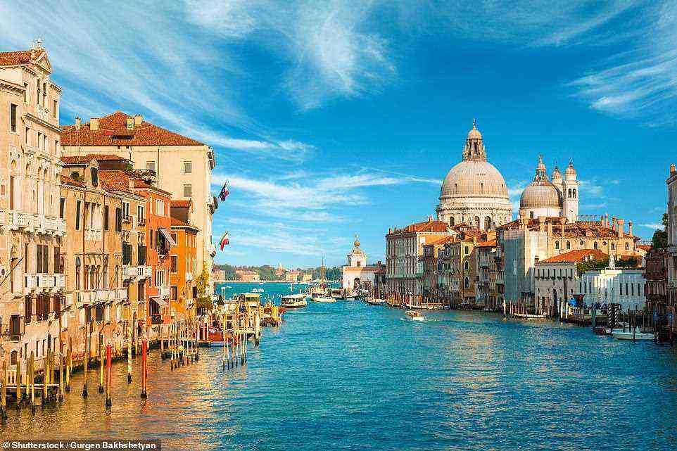'However many times you have been, there’s a dream-like quality to Venice,' James says. Pictured is the city's Grand Canal
