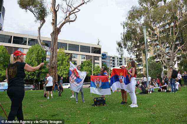 Djokovic supporters draped in Serbian flags chanted his name outside the hotel on Thursday afternoon