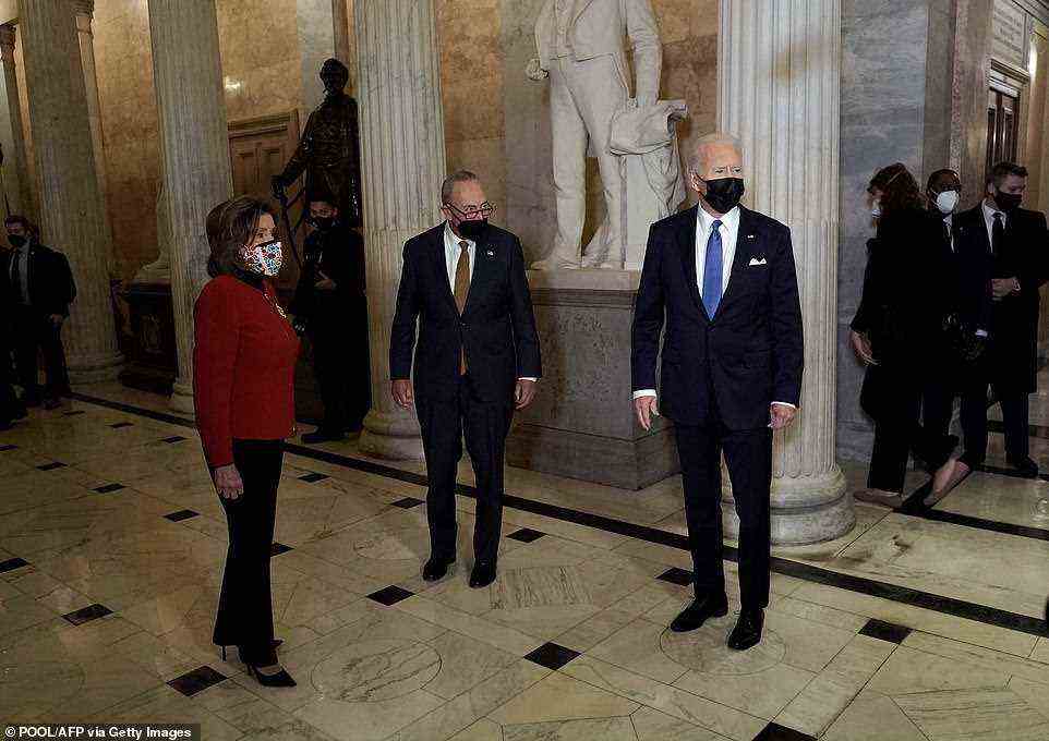 President Joe Biden (right) enters the U.S. Capitol alongside House Speaker Nancy Pelosi (left) and Senate Majority Leader Chuck Schumer (center)