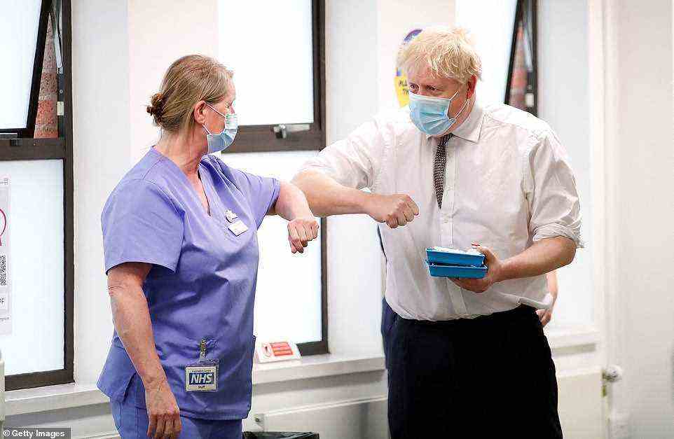 Boris Johnson (pictured at a Covid vaccine centre in Northampton today) claimed the NHS has enough staff to see through the Omicron wave in a bid to downplay hospital pressure despite two dozen trusts declaring 'critical incidents' and waiting lists hitting new highs