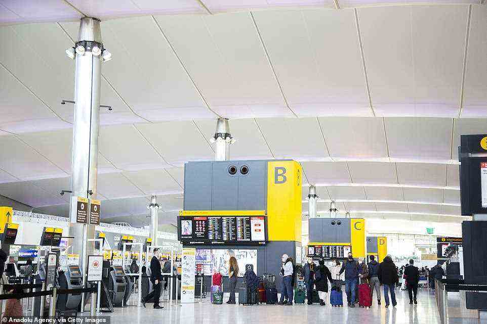 Passengers walk around the departures area of London Heathrow Airport today after the rules were changed