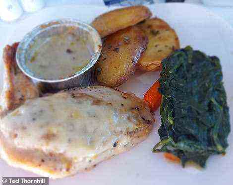 The main - 'succulent roast Parmesan chicken breast with steamed spinach, carrots, baby potatoes and wild mushroom sauce'