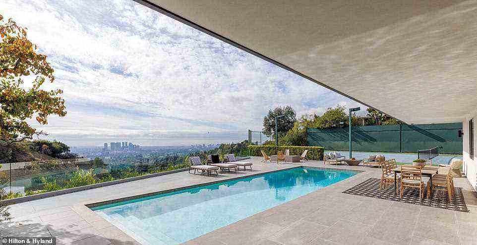 Classic: Outside, the property features a sleek rectangular swimming pool
