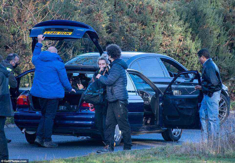 Cast and crew could be seen chatting as they filmed the scene for the Netflix show. The fifth season is due out in November of this year