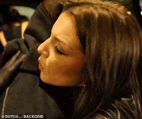 Laying it on thick! Getting up close to the cameras, Julia leaned in for a kiss with her new beau Kanye
