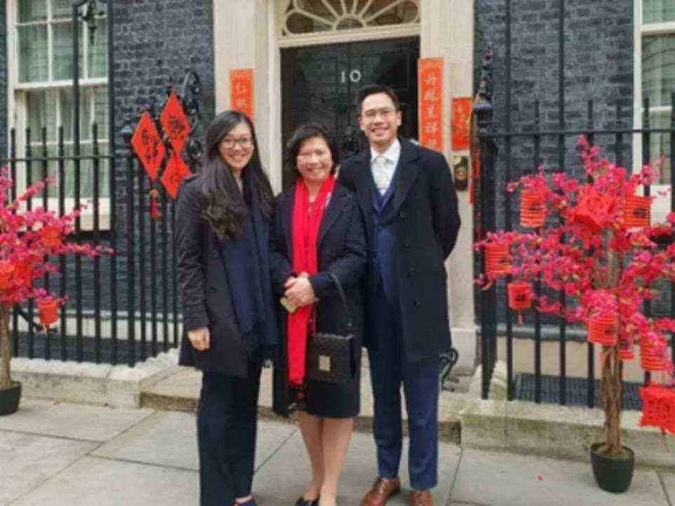 A photo of Ms Lee in front of 10 Downing Street in 2019 shows the iconic door draped with red banners displaying New Year couplets in Chinese characters and announcing the 'Golden Era' of Sino-British relations. She is accompanied by Alex Yip, a Tory councillor in Birmingham and vice-chairman of the British Chinese Project
