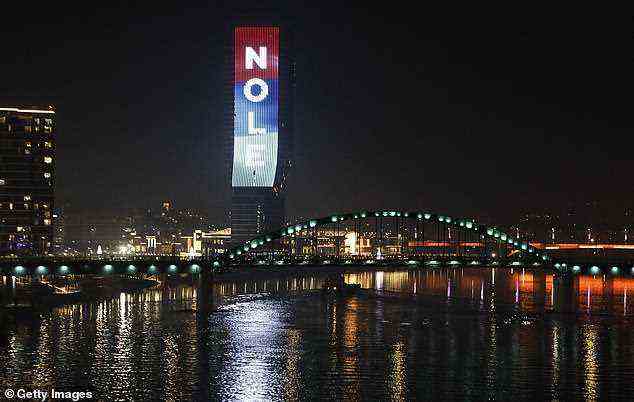 The prominent Belgrade Tower in the Serbian capital was lit up with Djokovic's nickname 'Nole' overnight (pictured)
