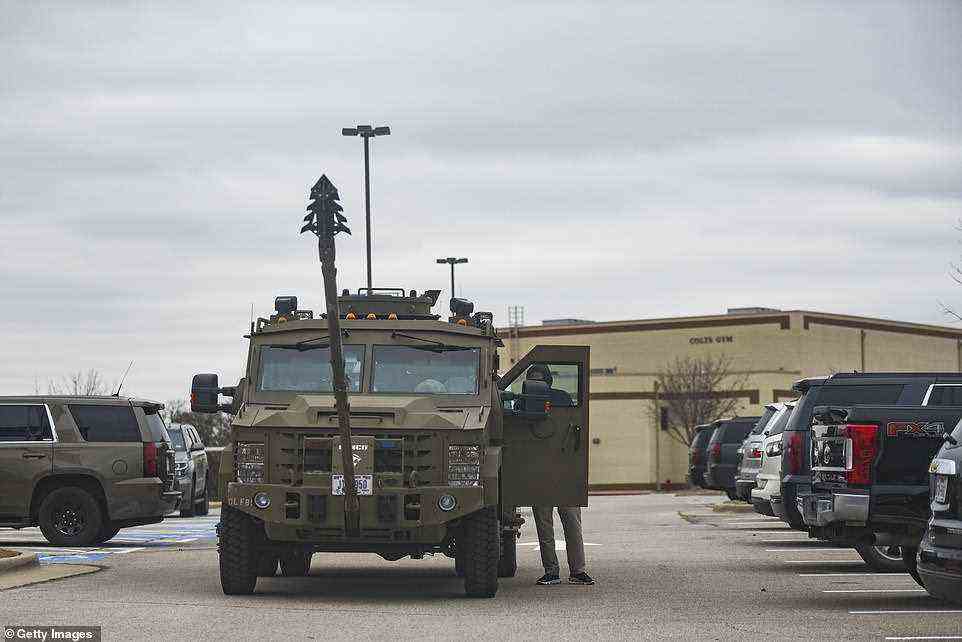 Armored vehicles are at the scene where the assailant claims to have bombs as the FBI attempts to diffuse the situation
