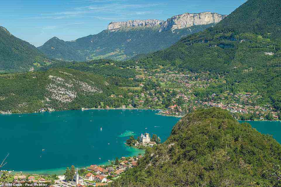 CRETE DU TAILLEFER, LAC D'ANNECY: The view of Chateau de Ruphy 'jutting into the blue water of Lac d'Annecy' was immortalised by Cezanne when he painted it in 1896, the authors write. But this view of it from the Crete du Taillefer rocky ridge 'is arguably even better'.  The path to it is signed from Rue du Vieux Village. Coordinates: 45.8151, 6.1999