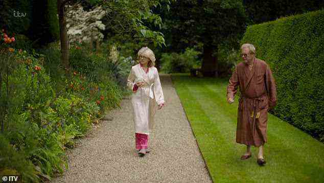 Touring the grounds: Alexandra Sitwell and her husband Rick strolled through Renishaw Hall, in Derbyshire, in their dressing gowns and pyjamas