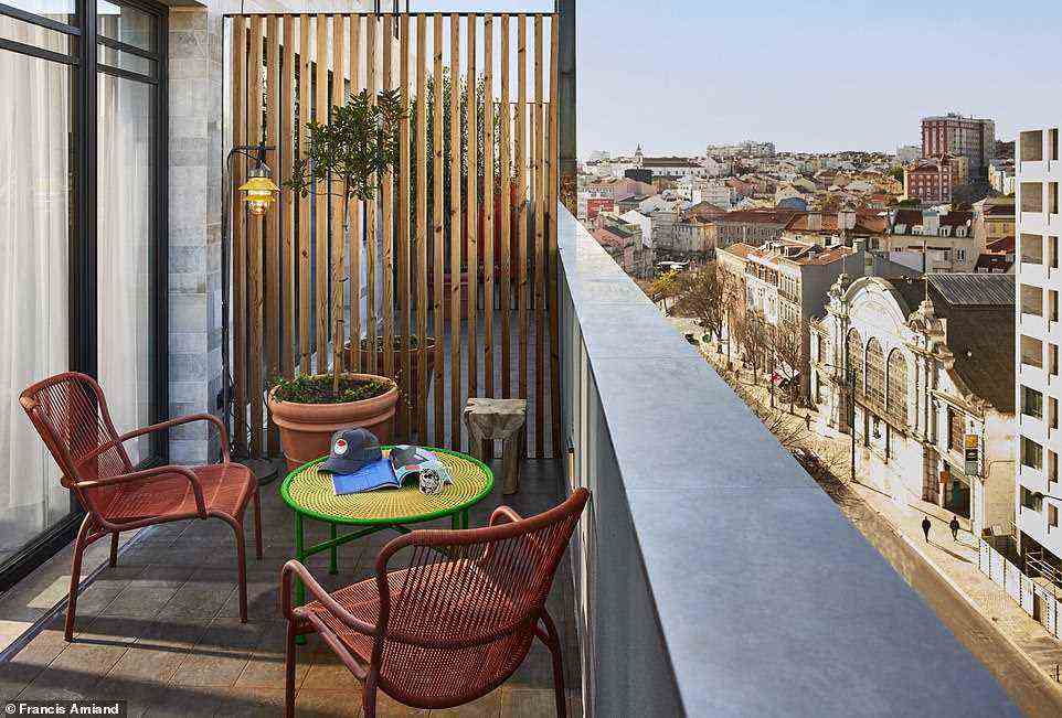 Pictured is one of the balconies at the 'stylishly budget' Mama Lisbon, which opened last week