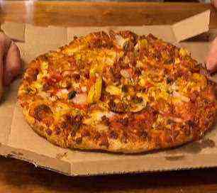 In other videos, he turned a pie of Domino's pizza (pictured), a hot dog and pretzel from a stadium food stand, a Chipotle burrito bowl, and more into gourmet dishes